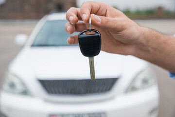 Car Key in Owner's Hand: Car Sale