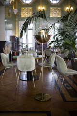 modern table setting in a trendy restaurant. Sofa, armchair, table and dishes on the table