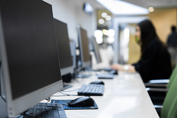 Employees Working on Computers in Office
