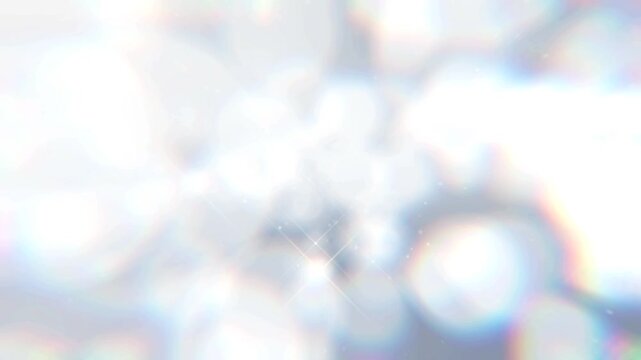 シルバー系のキラキラ素材が下から上に漂うようにゆっくり移動する