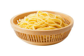 Freshly cooked yellow spaghetti in a bamboo bowl on white background, cut out