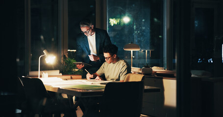 Night, programmer meeting and tablet for test, feedback and overtime work for data analysis notes. Business men, mentor and collaboration for web design, cloud computing or b2b networking deadline