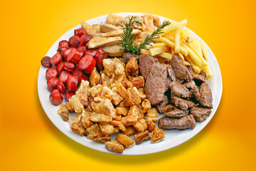 Plate of snacks, meat, potatoes, sausage, cracklings
