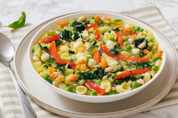 Vegetarian Minestrone with in white bowl, top view