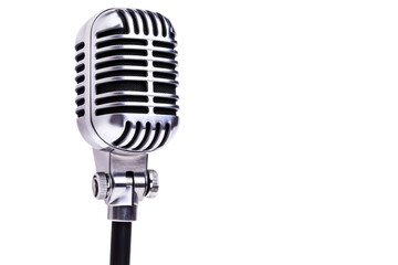 Fototapeta premium Classic retro microphone with vintage chrome design on black background, cut out