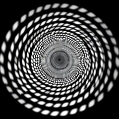 Black and white circular pattern creates spinning illusion, optical art, rotating