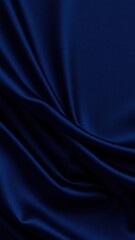 Fototapeta premium Abstract blue black background. Navy blue silk satin texture background. Beautiful soft wavy folds on shiny fabric. Dark elegant background for your design.