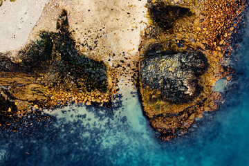 Aerial View of the Rugged Irish Coastline in Howth, Dublin – Rocky Cliffs and Blue Sea