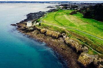 Aerial Drone View of the Irish Rocky Coastline With Martello Tower in Howth – Cliffs, Blue Sea and Lush Greenery