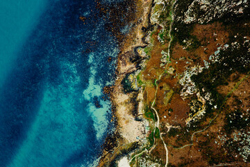 Aerial View of the Rugged Irish Coastline in Howth, Dublin – Rocky Cliffs, Blue Sea, and Lush Greenery