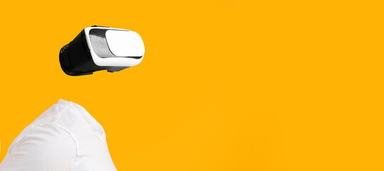 A user engaged in virtual reality without visible head or face, immersed in augmented reality. The...