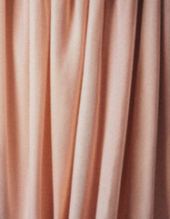 Elegant pink curtain creating a soft and warm atmosphere in a room