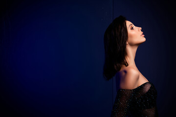 Passionate Woman in Stylish Fashion Posing in Neon Lighting on a Contemporary Background of Modern Art and Glamour