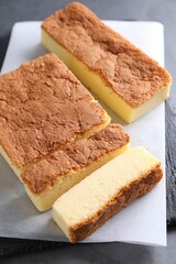 Tasty Japanese Castella sponge cake on grey table, closeup