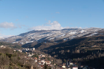 Snow-Covered Mountains under a Clear Blue Sky