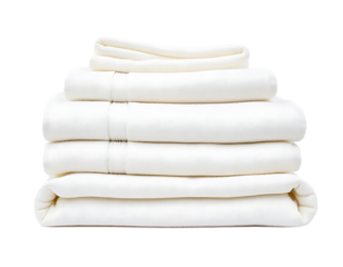 Pile of neatly folded white bed sheets