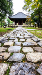 Obraz premium Stone path leading to traditional Asian temple in serene garden
