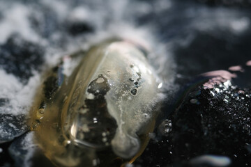 Layer of oil spread thinly on water surface