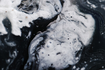 Layer of oil spread thinly on water surface