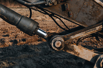 Close-Up of Excavator Hydraulic Cylinder at Construction Site