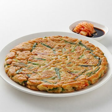 Korean Bindaetteok Mung Bean Pancake with Crusty Golden Surface and Kimchi Side