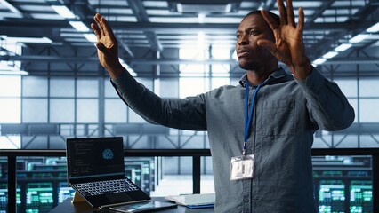 Computer scientist looking at holograms in data center, using artificial intelligence. African american admin interacting with augmented reality AI visualization in server hub, camera B
