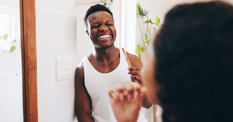 Bathroom, brushing teeth and couple with toothbrush in home for dental care, mouth hygiene and...