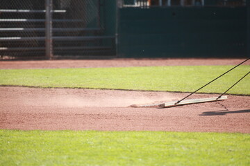 Dragging baseball infield, sports field dust