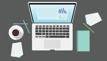 Workplace desk showing laptop displaying statistical charts, coffee, notepad and pencils