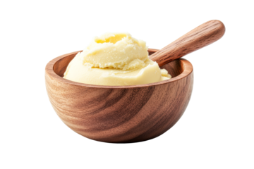 Shea butter in wooden bowl with wooden spoon, cut out transparent