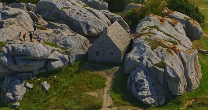 France, Meneham, 26 February 2025: Aerial view of an ancient stone house in the rocks