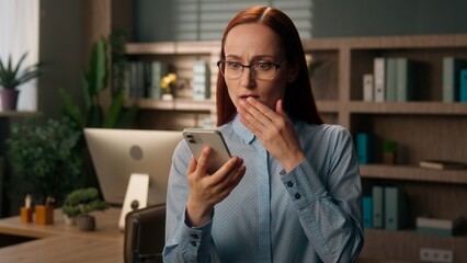 Stressed woman Caucasian girl upset frustrated businesswoman worker office holding mobile phone...