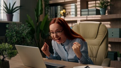 Excited happy businesswoman girl female entrepreneur cheerful business woman win laptop victory...