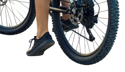 Young female cyclist cycling on a transparent background.