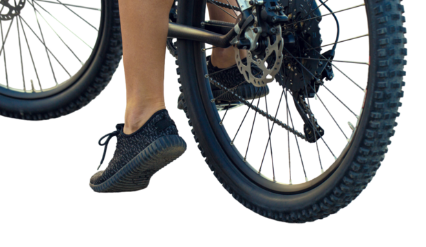 Young female cyclist cycling on a transparent background.