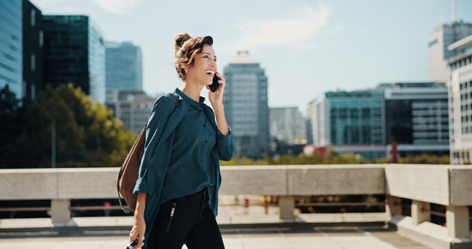 Travel, laugh and woman with phone call in city, commute and real estate agent with negotiation. Urban, business realtor and walk with mobile for discussion, journey and contact for property question