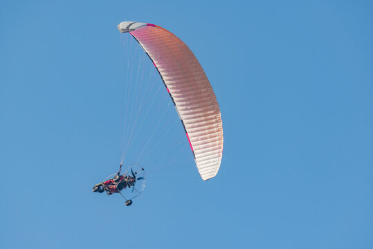 Paraplane on the blue sky background.