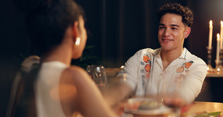 Smile, couple and red wine on date at restaurant for valentines day, romantic dinner and celebration. People, talking and alcohol with fine dining, anniversary and bonding for relationship commitment