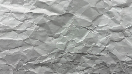 Crumpled white paper texture with wrinkles and creases. Perfect for backgrounds, graphic design, editing, and overlays.