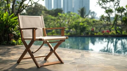 Wooden director's chair by poolside.