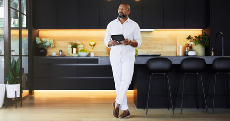 Kitchen, tablet and thinking with black man in home as realtor to search for interior design ideas....
