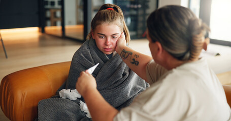 Sick girl, mom or fever with thermometer on sofa for illness, influenza or virus at home. Teenager, mother and daughter with checkup or temperature for viral infection, healthcare or results at house