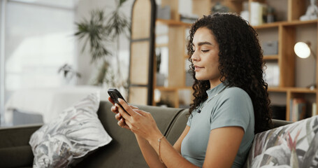 Woman, phone and relax on sofa with texting, click or search for valentines day date in living...