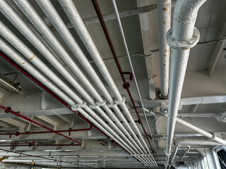 Overhead View of Industrial Pipes and Framework in a Ferry Ship Setting with Metallic Elements