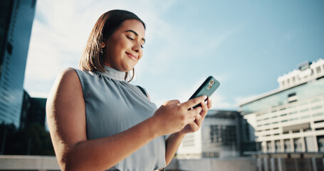 City, businesswoman and smile with smartphone for search, information and real estate agent. Low angle, female person and realtor with mobile for property listing, application and scroll on website