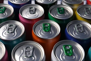 Many aluminium cans of beverage as background, closeup