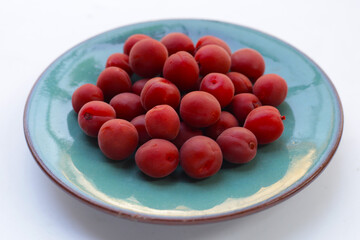 Umeboshi, Japanese pickled plums, Sour and salty taste.