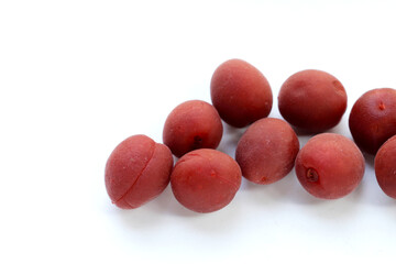 Umeboshi, Japanese pickled plums, Sour and salty taste.