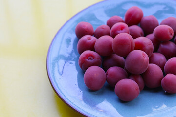 Umeboshi, Japanese pickled plums, Sour and salty taste.