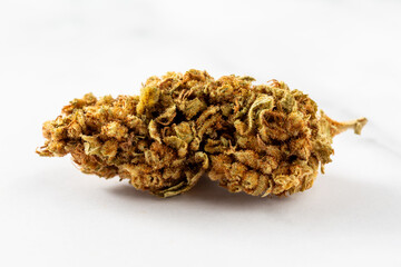 Dried cannabis on white background